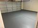 Spacious garage with epoxy flooring, ideal for parking and storage at 417 Raindance Dr, Henderson, NV 89014