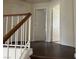 Hallway featuring hardwood floors and white trim at 417 Raindance Dr, Henderson, NV 89014