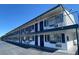 Exterior view of building with black security features, window boxes, and neutral paint at 4600 University Center Dr # 99, Las Vegas, NV 89119