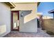 Attractive single door entry way with an outdoor light fixture and brick flooring at 463 Harmony Bay Ave, Las Vegas, NV 89138