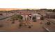 Stunning aerial view of a Southwestern-style home, showcasing the tile roof and desert landscape at 519 N Racetrack Rd, Henderson, NV 89015
