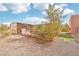 Rustic backyard features fenced animal enclosure, decorative yard with gravel and artificial turf at 519 N Racetrack Rd, Henderson, NV 89015