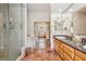 Bright primary bathroom with tile floor, double vanity, shower and soaking tub at 519 N Racetrack Rd, Henderson, NV 89015