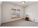 Bedroom with carpet, side table, ceiling fan, and natural light at 519 N Racetrack Rd, Henderson, NV 89015
