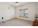 Bright bedroom featuring carpet, ceiling fan and lovely view at 519 N Racetrack Rd, Henderson, NV 89015