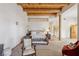Large bedroom with wooden beams showcases ensuite bathroom and seating area at 519 N Racetrack Rd, Henderson, NV 89015