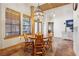 Bright breakfast nook featuring terracotta tile flooring, wooden accents, and ample natural light at 519 N Racetrack Rd, Henderson, NV 89015
