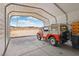 Large carport with open access, showcasing plenty of room for vehicle storage and views of the open land at 519 N Racetrack Rd, Henderson, NV 89015