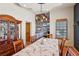 Charming dining room with a decorative ceiling, wooden furniture, and a view of the living room at 519 N Racetrack Rd, Henderson, NV 89015