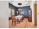 Elegant dining room featuring a decorative ceiling, wooden furniture, and stylish chandelier at 519 N Racetrack Rd, Henderson, NV 89015