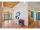 Welcoming entryway with terracotta tile flooring, natural wood accents, and ample natural light at 519 N Racetrack Rd, Henderson, NV 89015