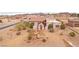 Expansive desert home with neutral tones and landscaped yard with native plants, situated in desert community near mountains at 519 N Racetrack Rd, Henderson, NV 89015