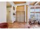 Spacious foyer boasting tile flooring, wood-beamed ceilings, and a decorative wood pillar near the front door at 519 N Racetrack Rd, Henderson, NV 89015