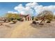 Beautiful Southwestern-style home featuring attractive desert landscaping and unique architectural details at 519 N Racetrack Rd, Henderson, NV 89015