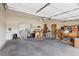 Spacious garage with an automatic door, storage shelves, and plenty of room for vehicles at 519 N Racetrack Rd, Henderson, NV 89015
