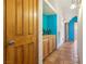 Hallway with Saltillo tile, leading to a naturally lit room at 519 N Racetrack Rd, Henderson, NV 89015