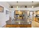 Kitchen with a large island and stainless steel appliances, featuring ample storage and prep space at 519 N Racetrack Rd, Henderson, NV 89015