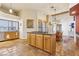 Bright, open kitchen with a large island, tile flooring, and ample counter space for cooking and entertaining at 519 N Racetrack Rd, Henderson, NV 89015