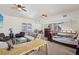 Loft-style living area featuring neutral tones, multiple seating options, and a work space at 519 N Racetrack Rd, Henderson, NV 89015