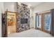 Living Room with tile floors, fireplace, and large windows at 519 N Racetrack Rd, Henderson, NV 89015