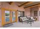 Comfortable covered patio with outdoor seating, perfect for relaxing and enjoying the desert climate at 519 N Racetrack Rd, Henderson, NV 89015