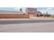 View of the home with a desert landscaped front yard and stucco walls at 519 N Racetrack Rd, Henderson, NV 89015