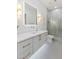 Elegant bathroom with dual sconces, a soaking tub, and a glass-enclosed shower at 5225 Villa Dante Ave, Las Vegas, NV 89141