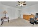 Neutral toned bedroom with ceiling fan, dresser, and a large closet at 5438 Cholla Cactus Ave, Las Vegas, NV 89141