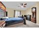 Bedroom with ceiling fan, window, and hardwood floors at 5438 Cholla Cactus Ave, Las Vegas, NV 89141