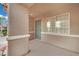 Close up of the covered front porch featuring neutral colored walls and trim at 5438 Cholla Cactus Ave, Las Vegas, NV 89141
