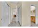 Bright hallway with multiple closets and an open doorway leading to the bathroom at 5438 Cholla Cactus Ave, Las Vegas, NV 89141