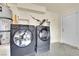 Laundry area featuring front loading washer and dryer and a utility sink at 5438 Cholla Cactus Ave, Las Vegas, NV 89141