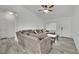Bright living room featuring a plush sofa, ceiling fan, and tile floors at 5438 Cholla Cactus Ave, Las Vegas, NV 89141