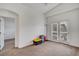 Minimalist bedroom with neutral walls, carpet, and balcony, offering calm tranquility at 5537 Parlay Way # 101, Las Vegas, NV 89122