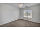 Simple bedroom featuring a window and a ceiling fan at 5537 Parlay Way # 101, Las Vegas, NV 89122