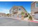 Charming multi-level townhouse featuring a private balcony and attached two-car garage at 5537 Parlay Way # 101, Las Vegas, NV 89122