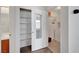 A hallway with linen closet provides seamless transitions between spaces in the house at 5537 Parlay Way # 101, Las Vegas, NV 89122