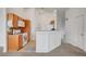 Efficient kitchen with bar seating and nearby staircase at 5537 Parlay Way # 101, Las Vegas, NV 89122