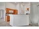 Spacious kitchen featuring bar and nearby staircase at 5537 Parlay Way # 101, Las Vegas, NV 89122