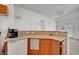 Well-lit kitchen with a sink, dishwasher, and views of the living area at 5537 Parlay Way # 101, Las Vegas, NV 89122