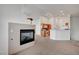 Open living space with fireplace transitioning into the kitchen at 5537 Parlay Way # 101, Las Vegas, NV 89122
