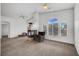 Spacious living room featuring a fireplace, fan and large windows which offer natural light at 5537 Parlay Way # 101, Las Vegas, NV 89122