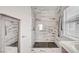 Elegant shower room with striking tile work, glass enclosure, and modern fixtures at 5537 Parlay Way # 101, Las Vegas, NV 89122