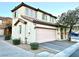 Beautiful two-story home with a two-car garage, desert landscaping and a stucco exterior at 6087 Devers Ct, Las Vegas, NV 89118