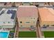 Aerial view of backyard with patio dining set, artificial turf, trampoline, and solar panels on the roof at 6346 Rock Strm Ln, Las Vegas, NV 89141