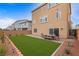 A newly landscaped backyard with patio, artificial turf, and dining table at 6346 Rock Strm Ln, Las Vegas, NV 89141