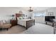 Bright bedroom with neutral carpet, large bed, and contemporary decor at 6346 Rock Strm Ln, Las Vegas, NV 89141