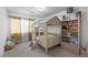 Playful bedroom features a house-frame bed, natural light, and colorful decorations at 6346 Rock Strm Ln, Las Vegas, NV 89141