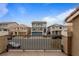 View of houses in neighborhood with blue sky and a car parked in front at 6346 Rock Strm Ln, Las Vegas, NV 89141