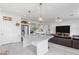 Open kitchen and living space with a large island, stainless appliances, and a seamless transition for entertaining at 6346 Rock Strm Ln, Las Vegas, NV 89141